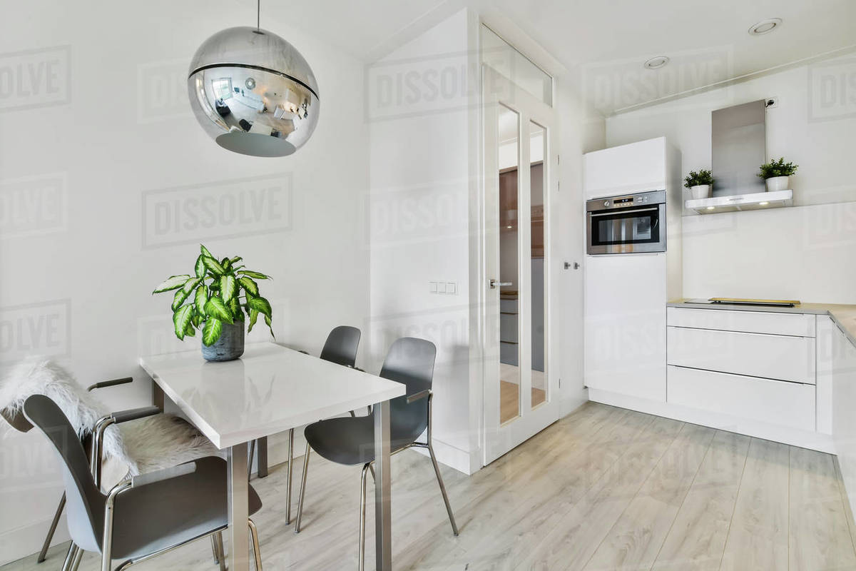 Stylish dining room with decorative table and chairs Stock Photo Dissolve