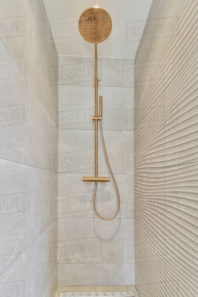 Modern shower cubicle with elegant dark tiles Stock Photo Dissolve