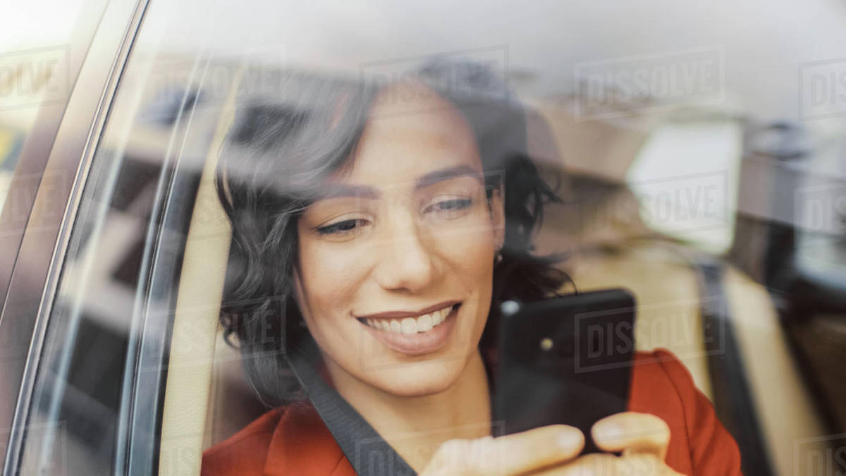 Beautiful Woman Traveling in a Car, Sitting on a Passenger Seat Uses