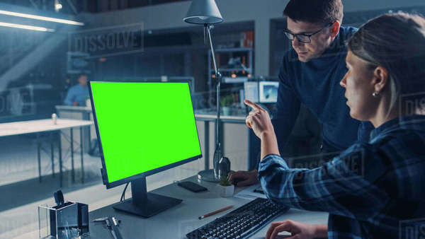 Engineer Working on Desktop Computer, Screen Showing CAD Software with ...