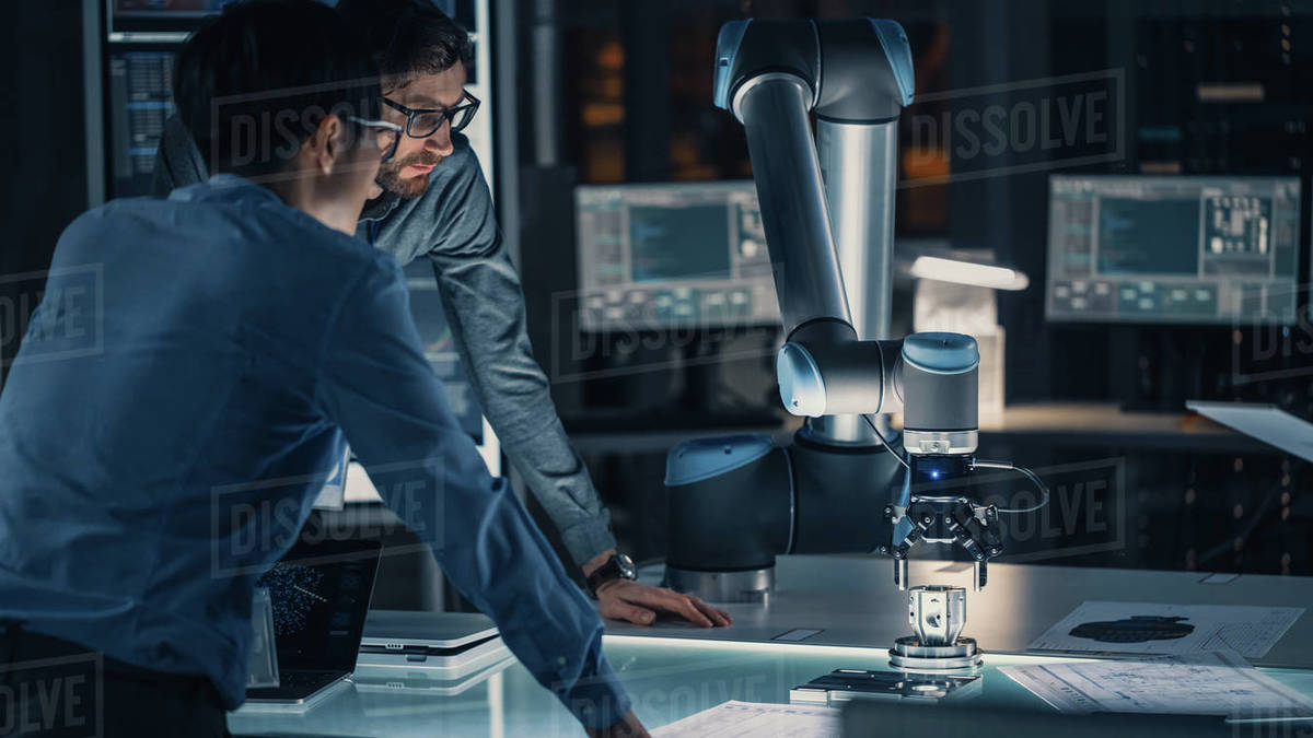 Diverse Team of Engineers Analyse and Discuss How a ...