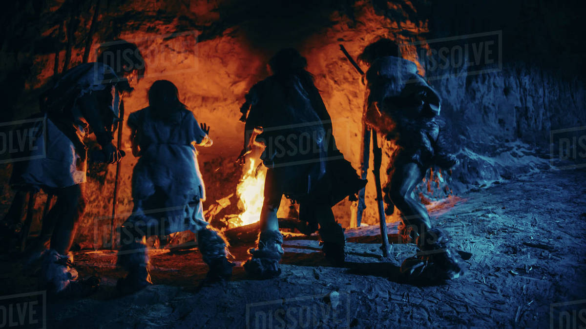 Tribe of Prehistoric HunterGatherers Wearing Animal Skins Dance Around