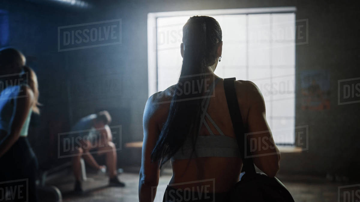 Shot of the Beautiful Athletic Woman Walking into Hardcore Gym. Ready