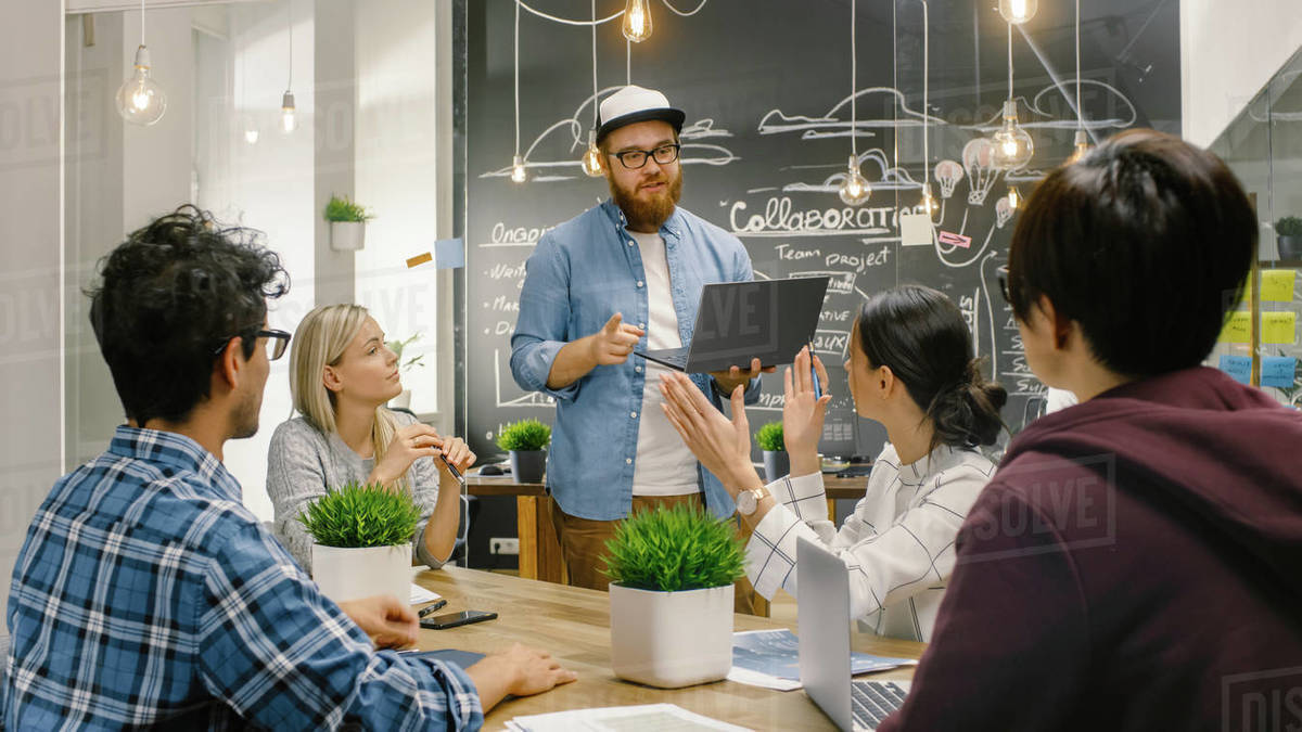 Creative Project Manager Holds Laptop and Talks to Talented Young ...
