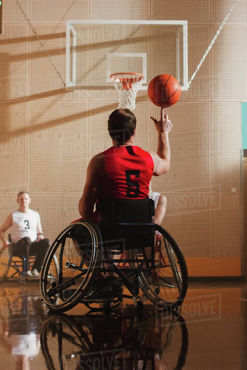 Wheelchair Basketball Play Player Spinning the Ball on His Finger