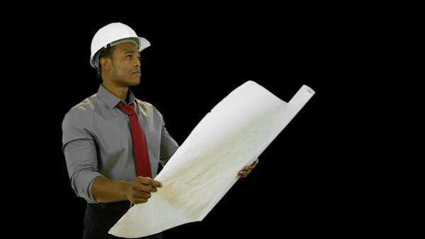 What It Takes To Be An Architect an architect holding a set of plans takes a call on his cell phone What It Takes To Be An Architect an architect holding a set of plans takes a call on his cell phone