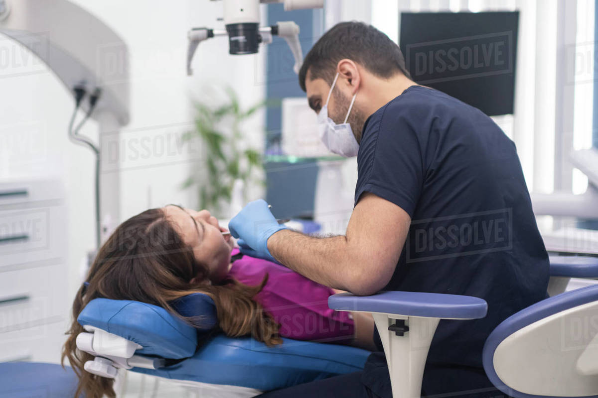 Dentistry clinic detailed checkup of female patient on couch focused