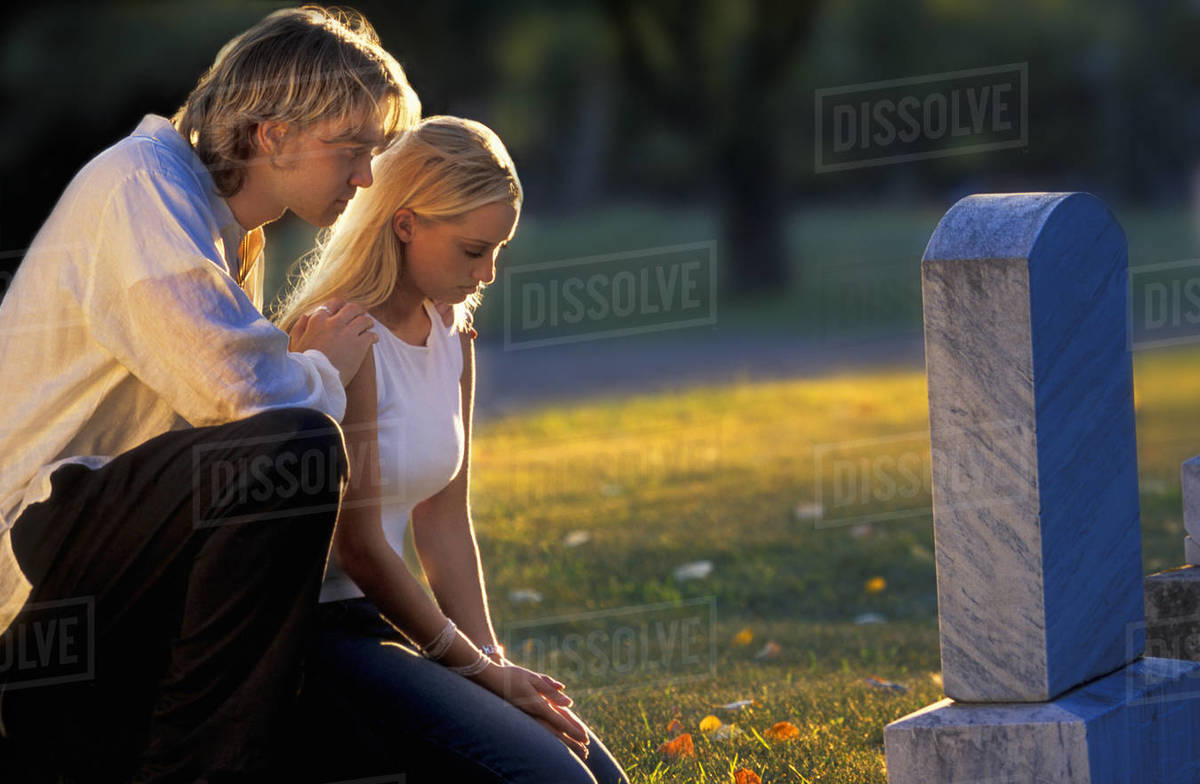 Visiting A Grave Stock Photo Dissolve