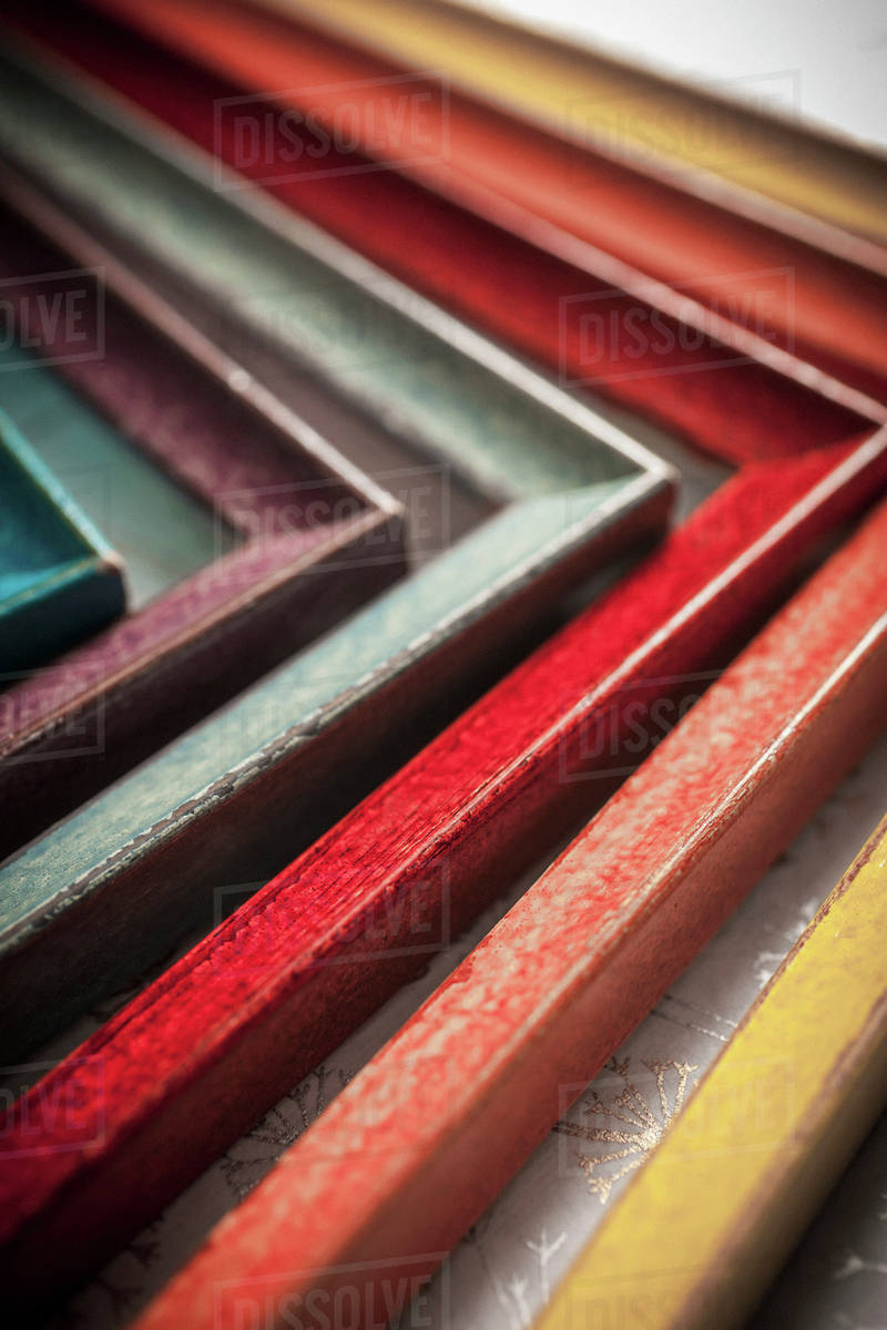 Colourful painted wooden picture frames set in side each other; Regina