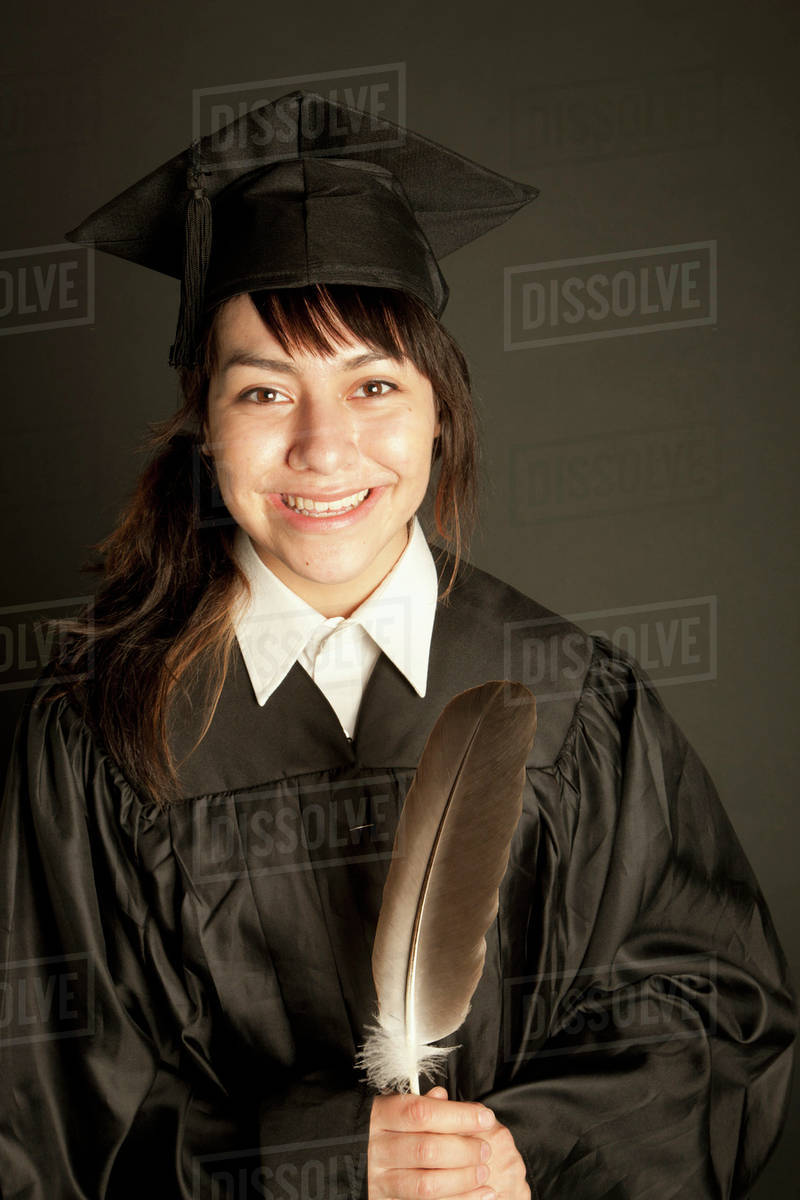 Young woman in graduation cap and gown; Edmonton, Alberta, Canada