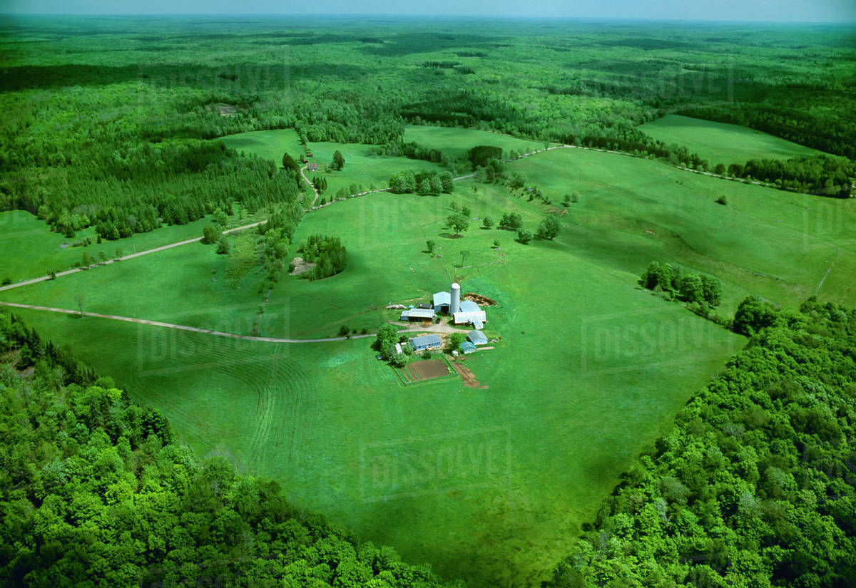 Agriculture Aerial view of a farmstead in Spring surrounded by lush