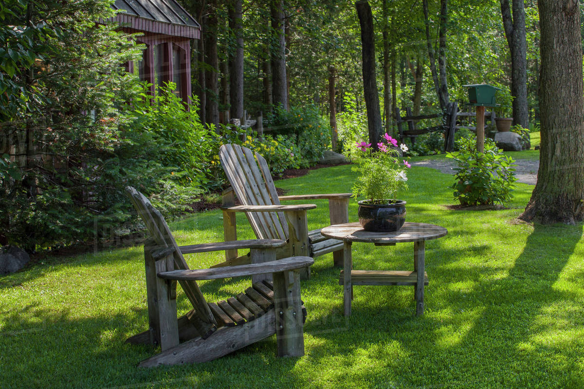 Adirondack chairs and flower pot; Knowlton, Quebec, Canada Stock