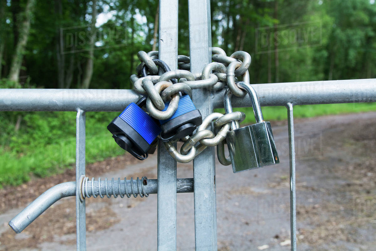 Gates securely locked with chain and padlocks; United Kingdom