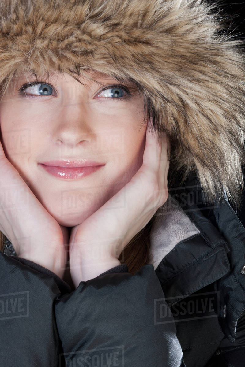 Young woman in a fur trimmed hood and winter coat; Edmonton, Alberta