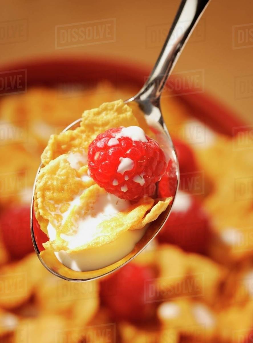 Raspberries In Cereal Stock Photo Dissolve