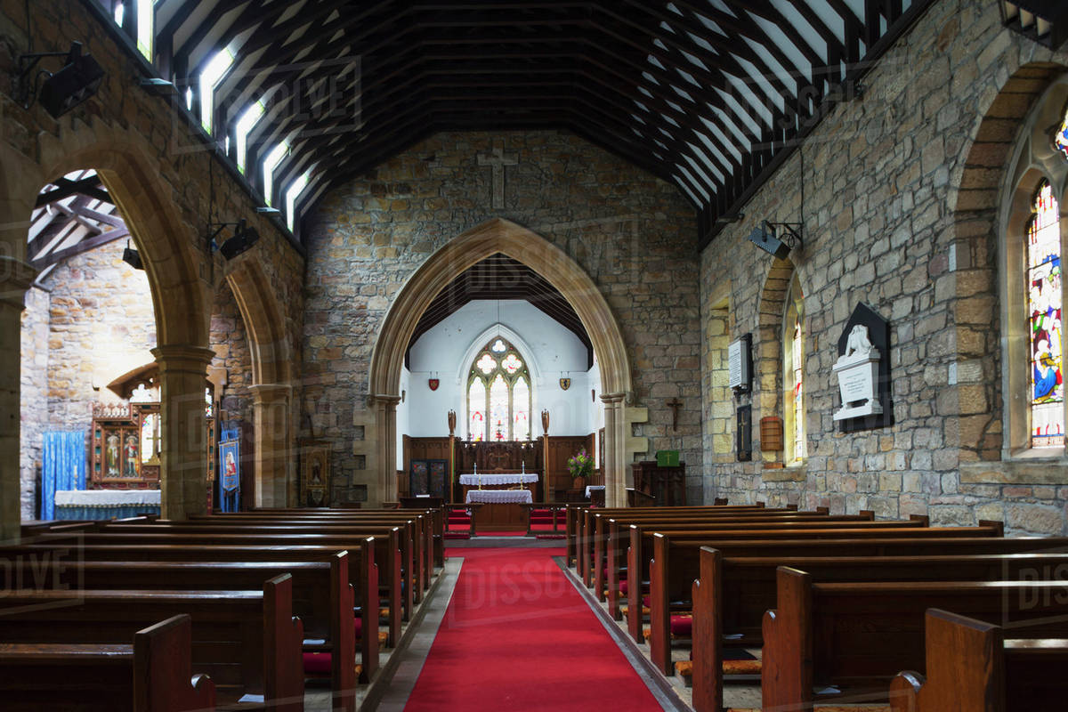 Red carpet down the aisle of a church leading to the altar; Helmsley