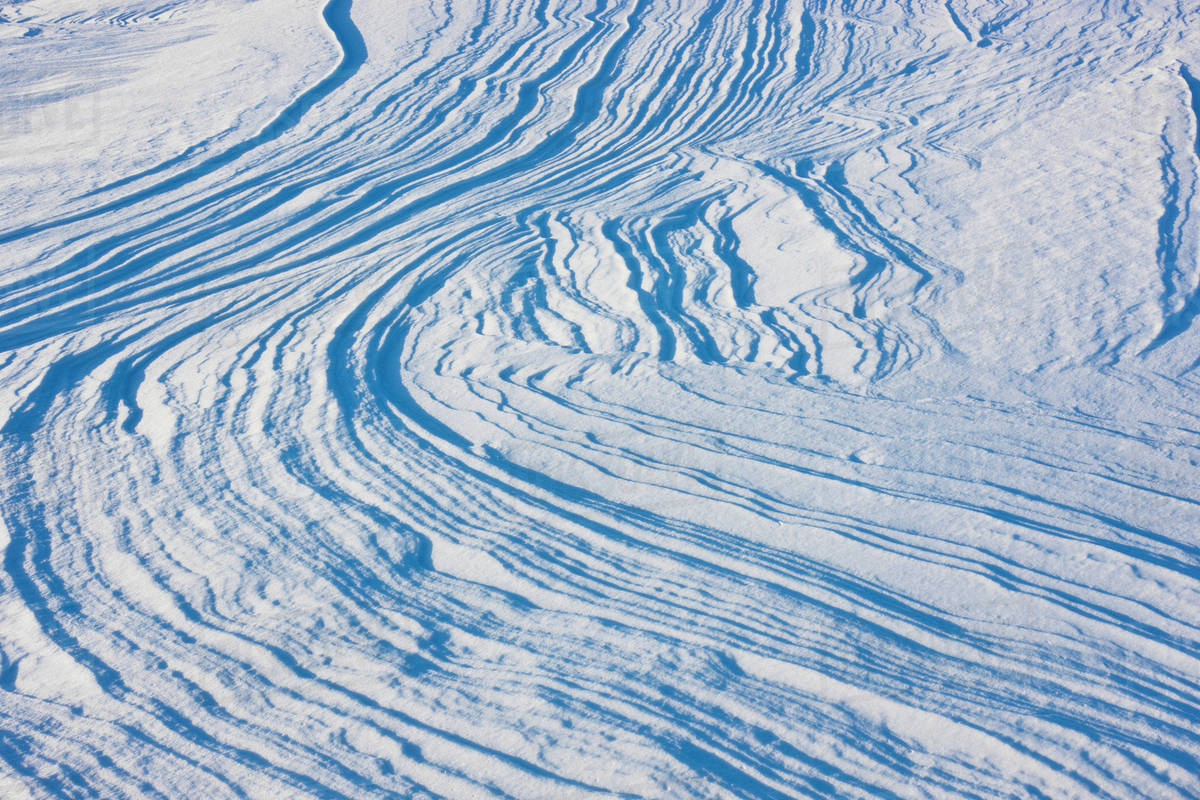 Wind-carved sastrugi ridges in snow