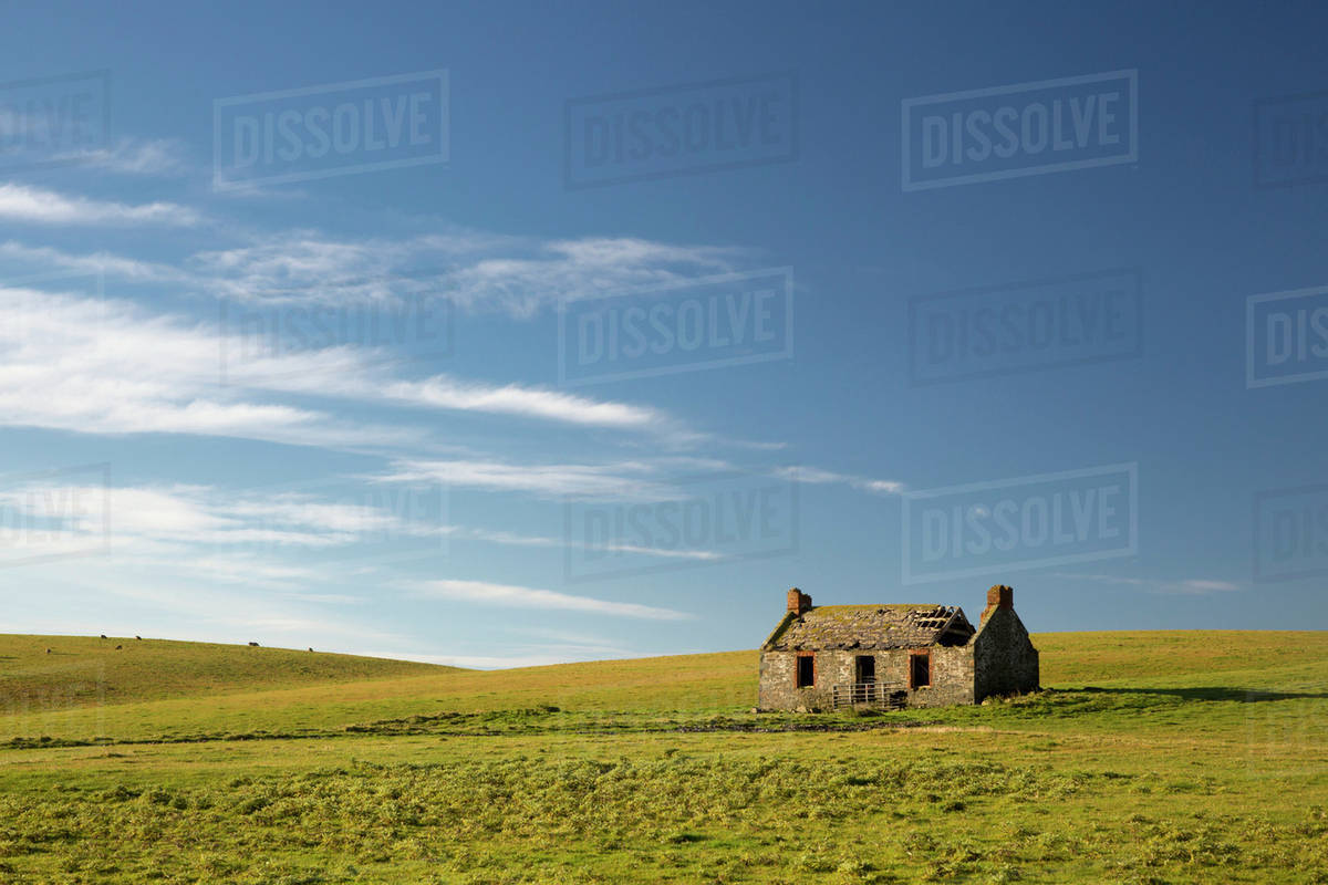 An abandoned farm building alone in the middle of a field;Dumfries and