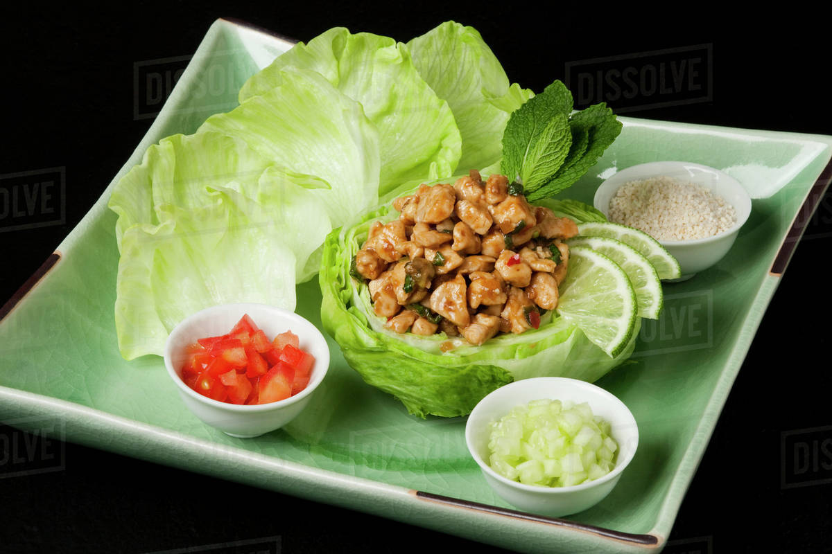 Food Larb Gai with baby Iceberg lettuce head. Ingredients include