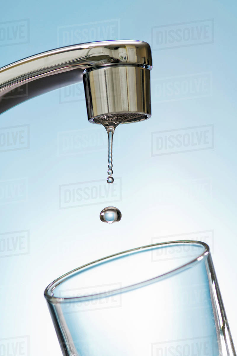 Water Drips From Kitchen Tap. Stock Photo Dissolve