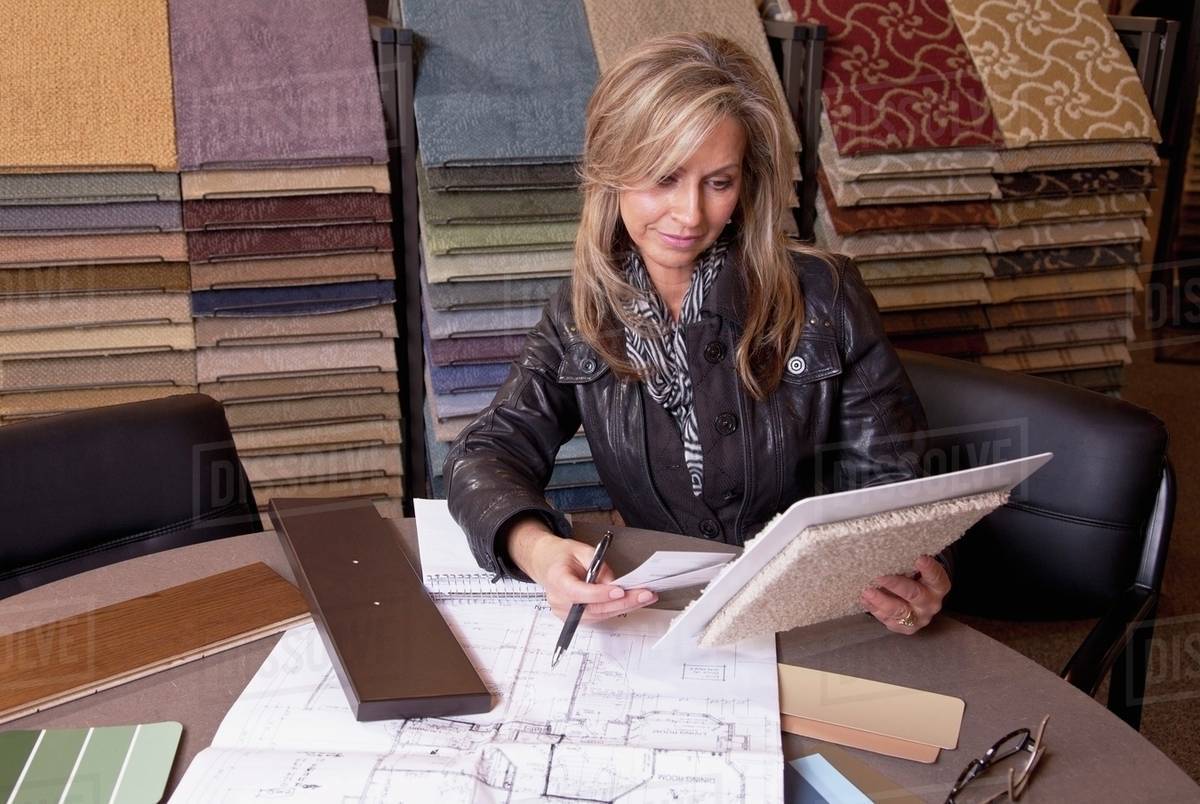 Customer Choosing Floor Coverings In A Retail Flooring Store; Edmonton, Alberta, Canada Stock