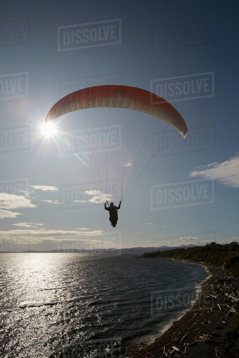 A Man Paragliding Along The Cliffs At Dallas Road; Victoria, Vancouver
