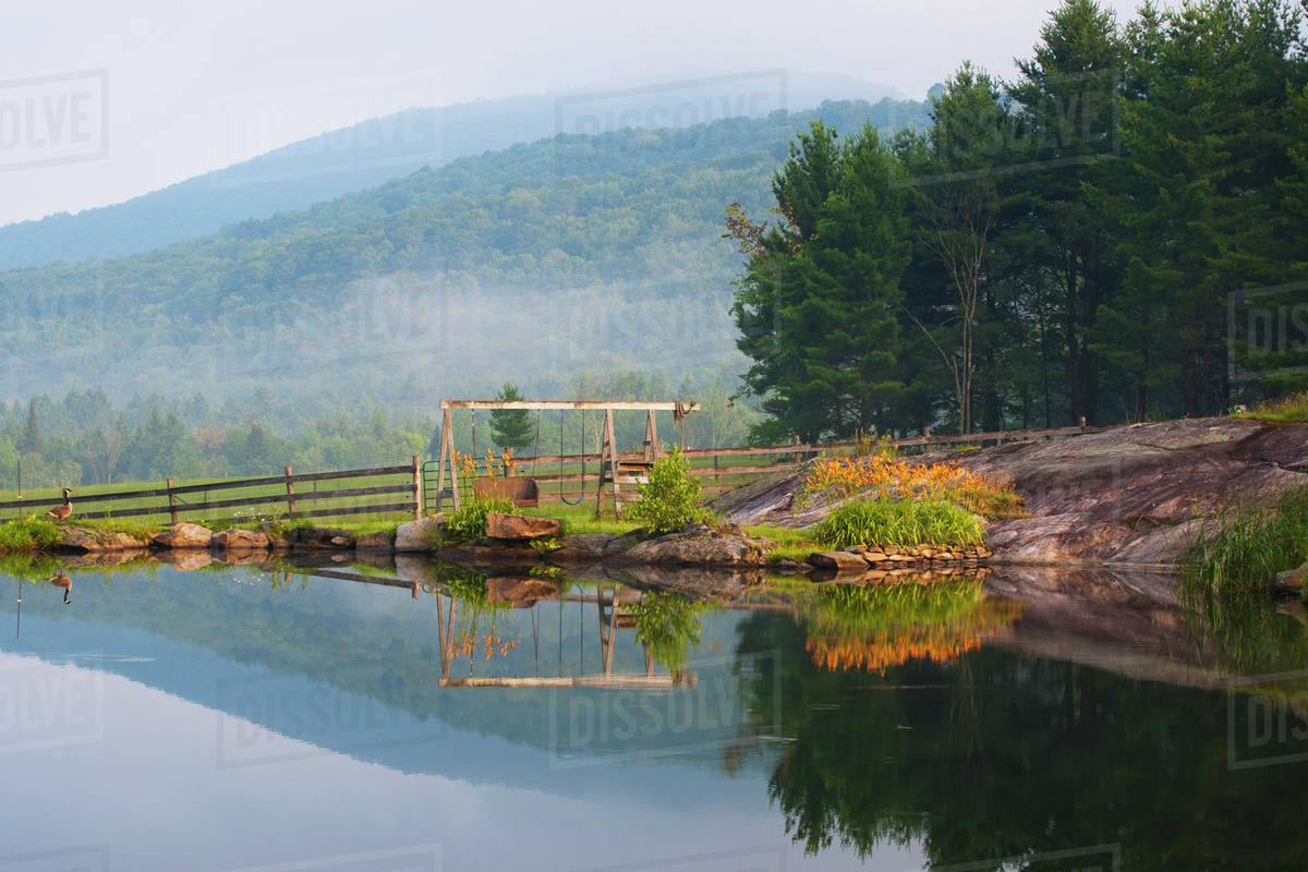 A Small Pond In The Early Morning Fog; Iron Hill, Quebec, Canada