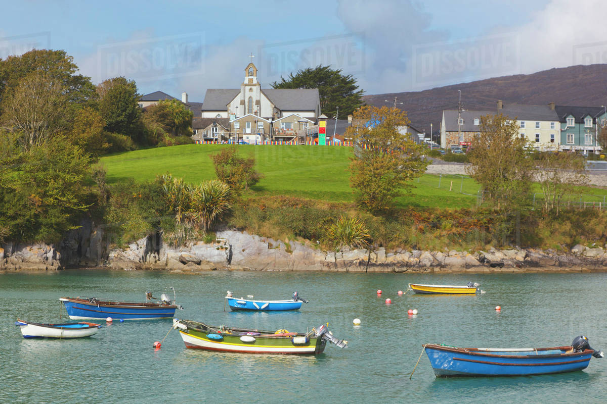 Boats in the harbour and buildings in the town;Schull county cork