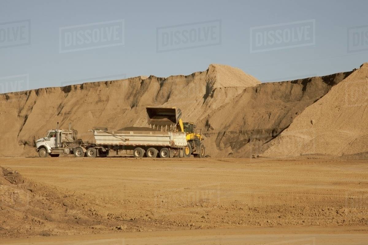 Moving Dirt On A Construction Site; Edmonton, Alberta, Canada Stock