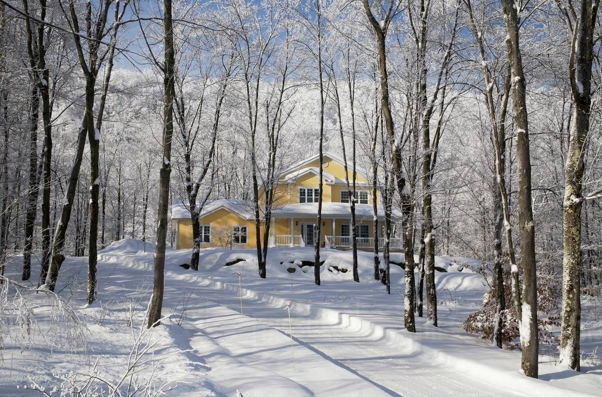 A Driveway And House Covered In Snow In The Winter; Shefford, Quebec