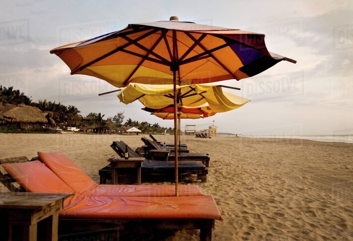 Mexico; Sun Umbrellas And Loungers Stock Photo Dissolve