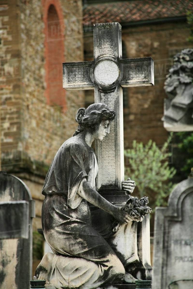 Florence, Italy; Statue Of Women Holding A Cross Stock Photo Dissolve