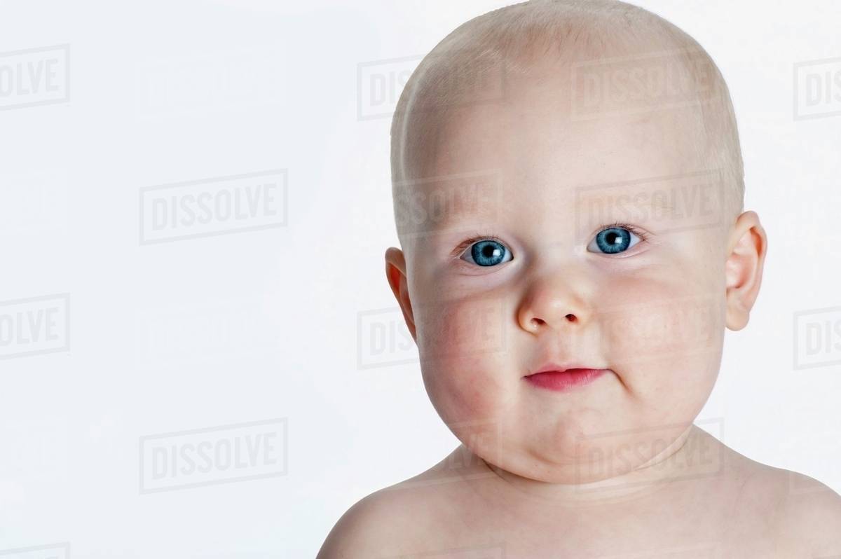 Portrait Of Baby With Blue Eyes Stock Photo Dissolve
