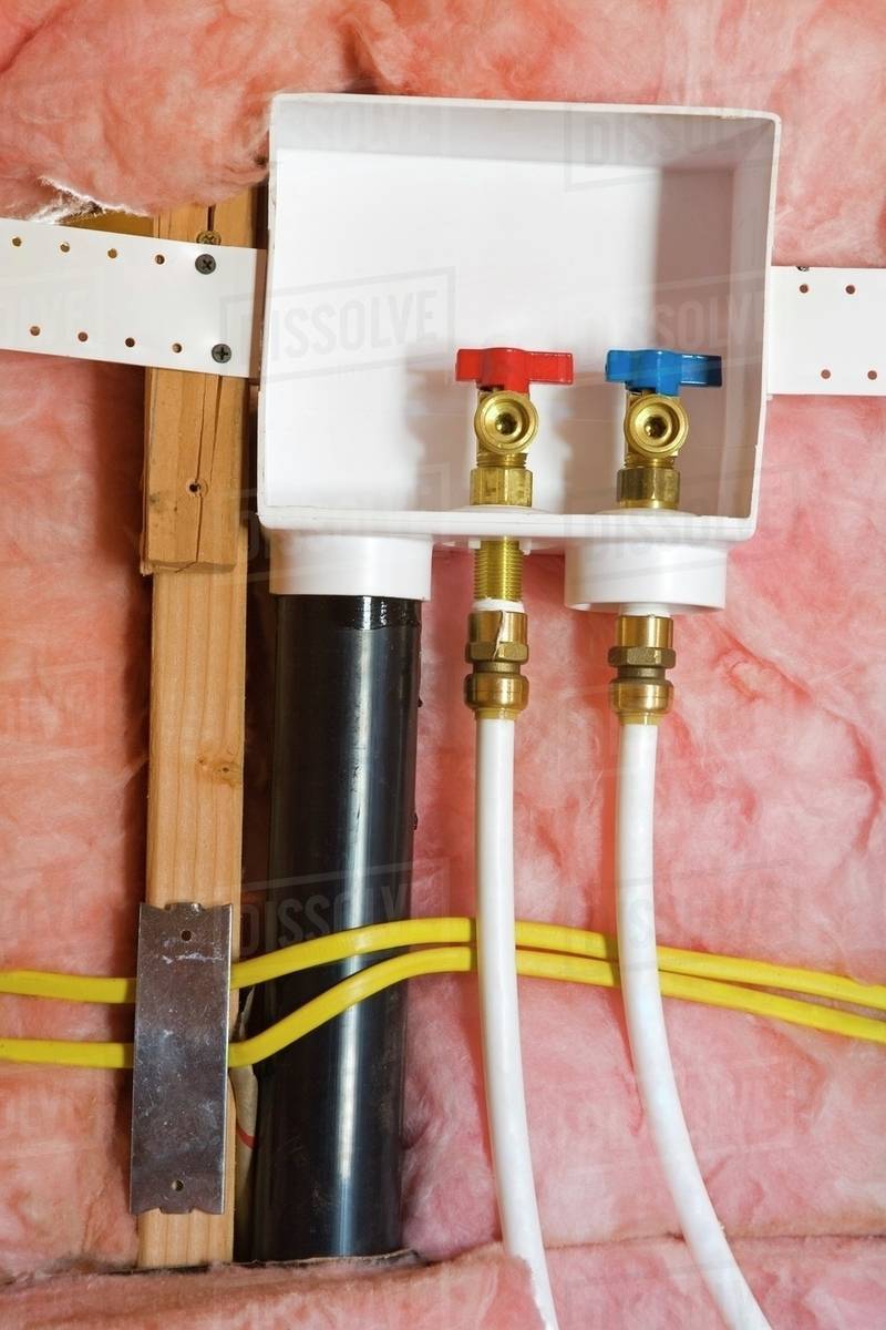 Plumbing; Exposed Hot And Cold Water Taps Stock Photo Dissolve
