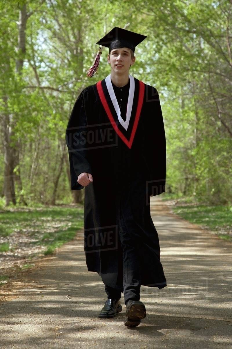 Graduate Walking On A Path Stock Photo Dissolve