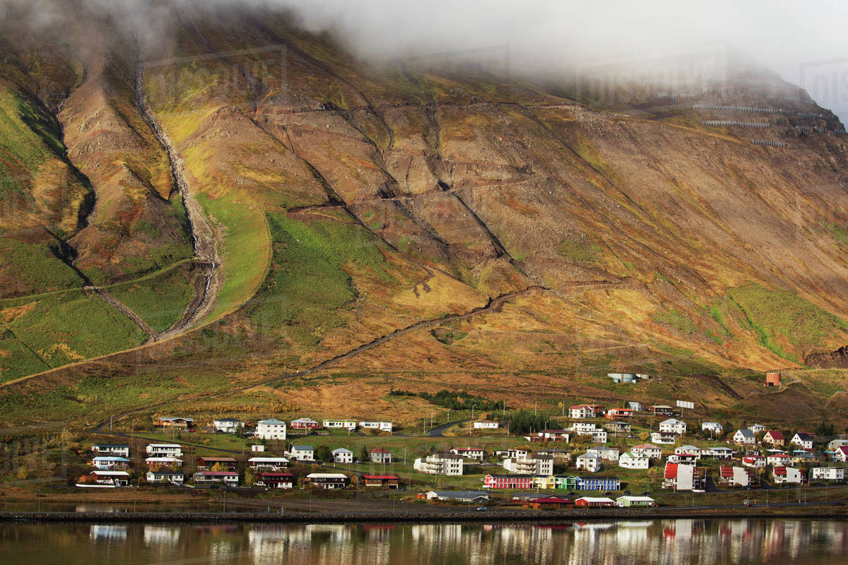 Colorful Houses In A Village Along The Coast; Siglufjordur, Iceland