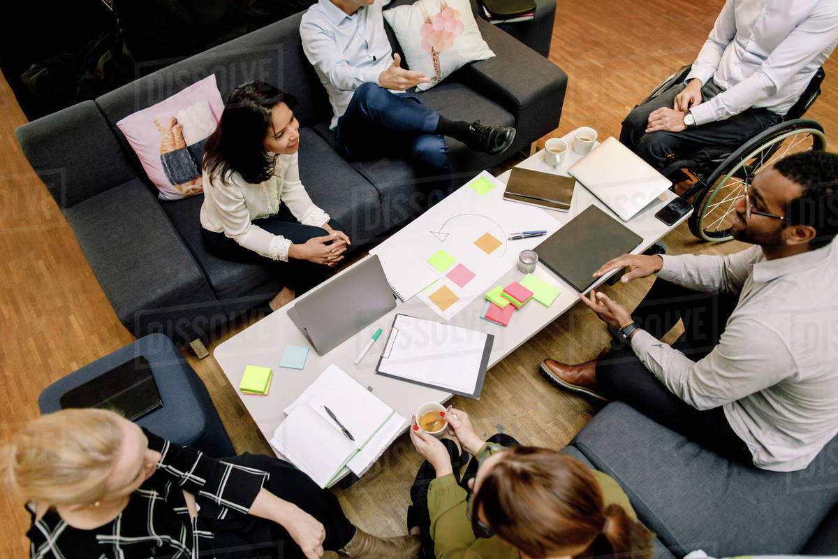 High angle view of sales managers talking during meeting at work place Royalty-free stock photo