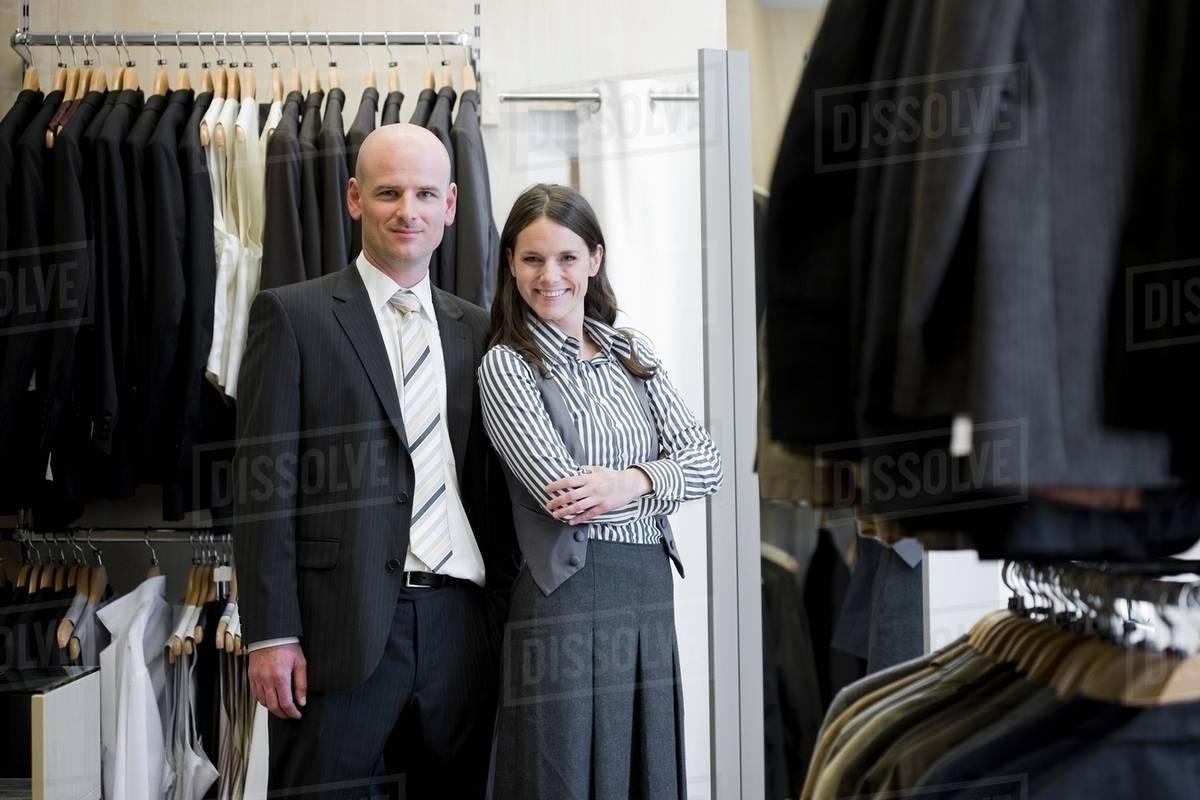 Man and woman in clothing store - Royalty-free Stock Photo | Dissolve