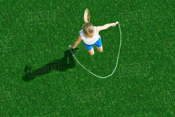 Girl jumping rope - Stock Photo - Dissolve