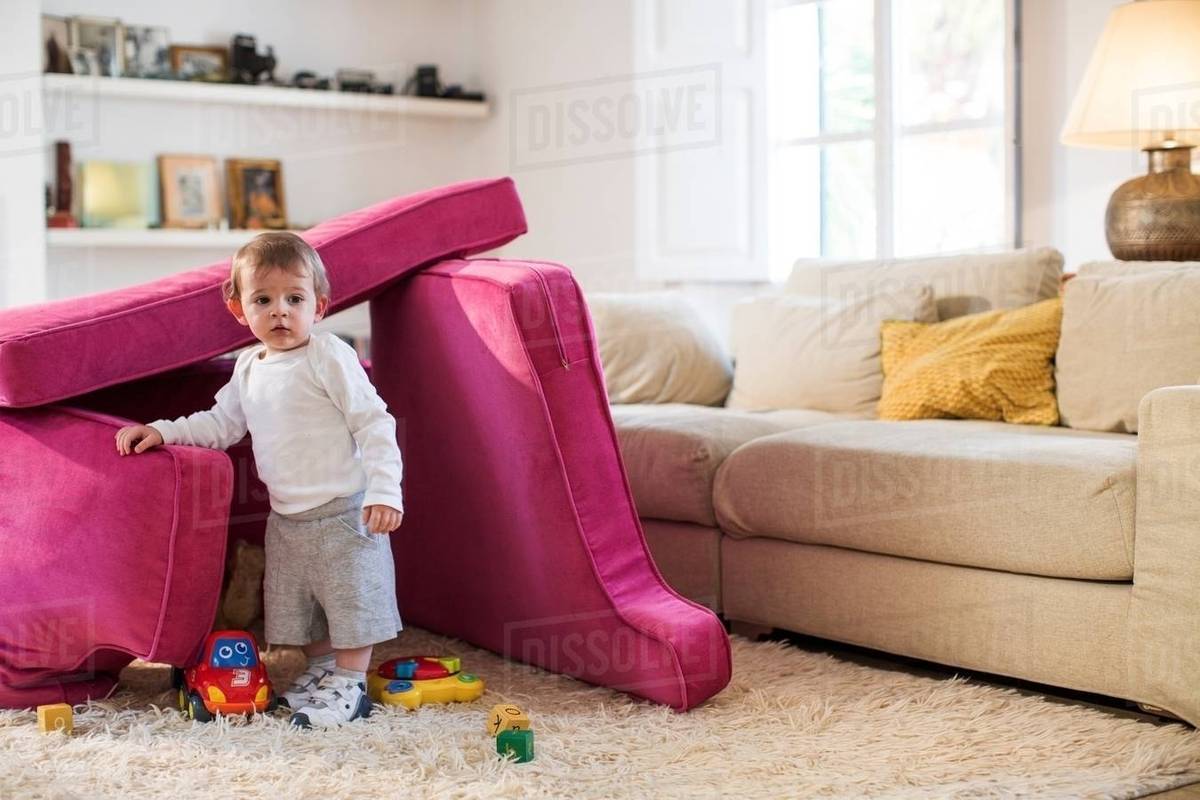 Baby Boy Playing In Fort Made From Sofa Cushions Stock Photo Baby Boy Playing In Fort Made From Sofa