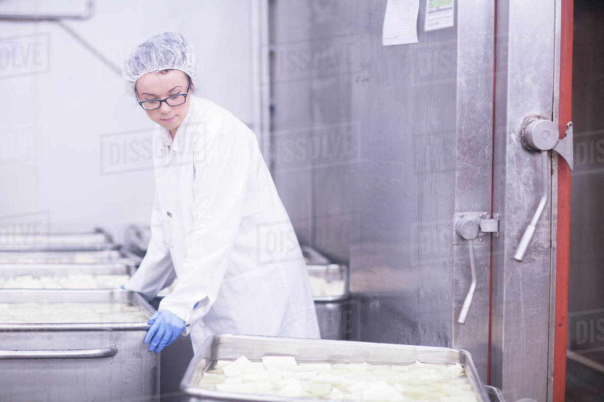 Factory worker working in food production factory Stock Photo Dissolve