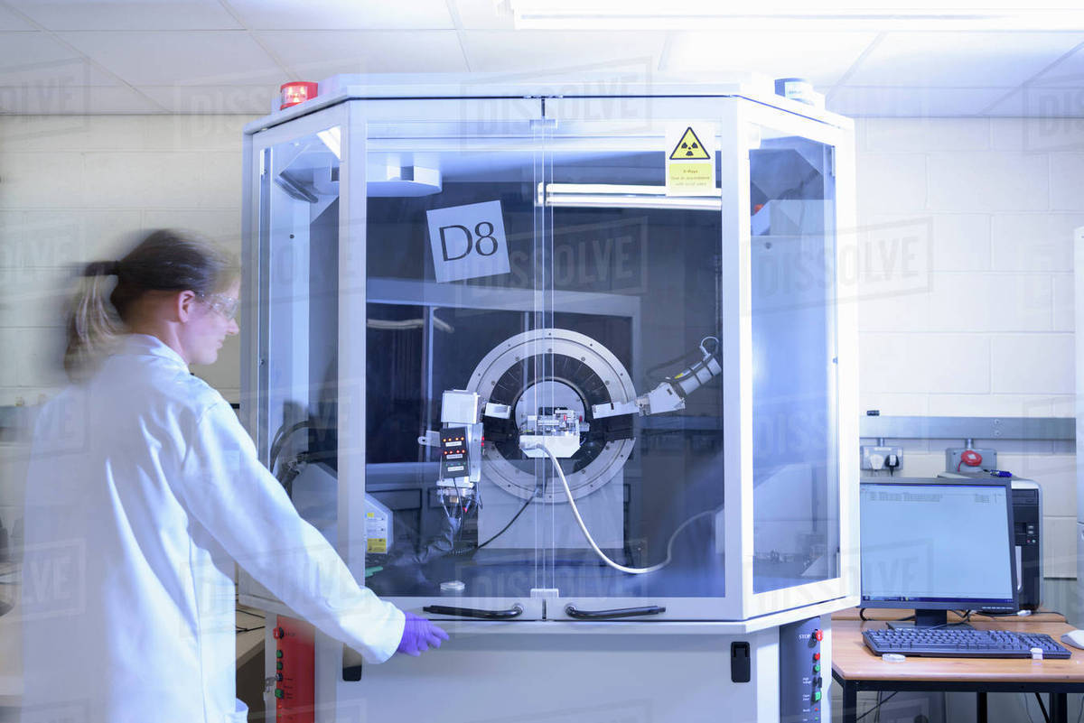 Scientist operating crystal xray diffraction machine in crystal