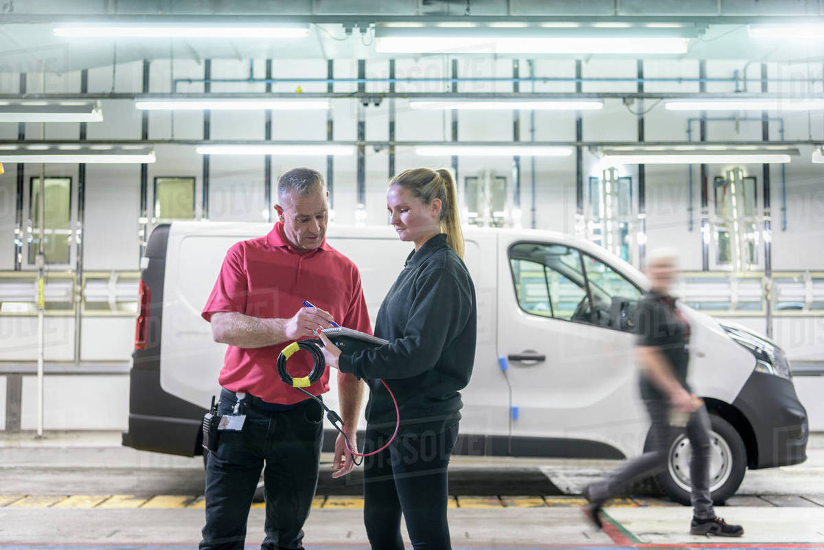 Female Apprentice Engineer With Mentor On Production Line In Car Factory Stock Photo Dissolve