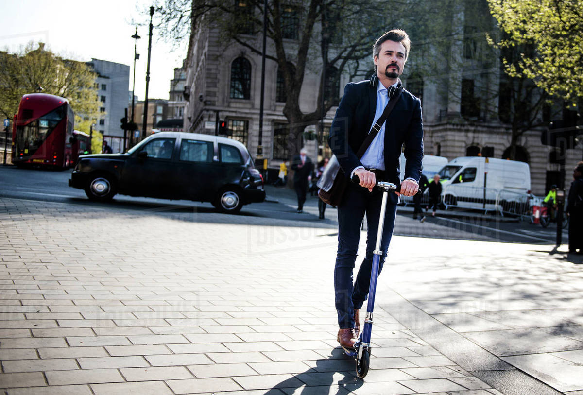 Businessman on scooter, London, UK Royalty-free stock photo