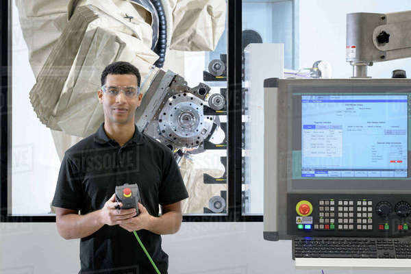 Engineer Programming Robot In Robotics Research Facility Stock