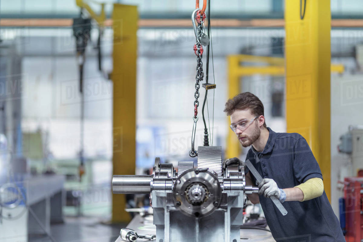 Engineer assembling gearbox in gearbox factory Stock Photo Dissolve