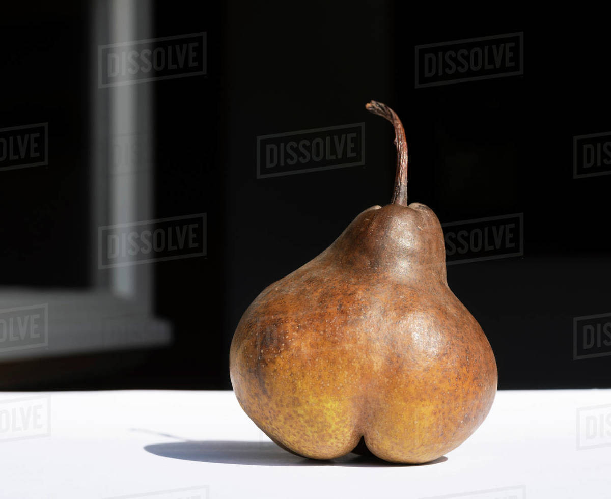 Pear in morning sun Stock Photo Dissolve