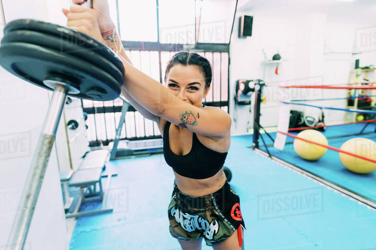 Female boxer lifting weights Stock Photo Dissolve