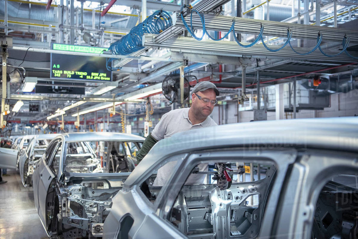 Workers On Car Production Line In Car Factory Stock Photo Dissolve