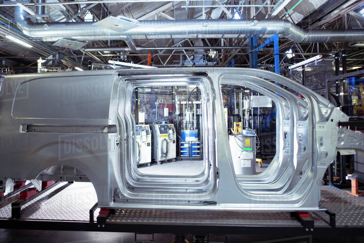 Side view of van bodies on production line in car factory Royalty-free stock photo